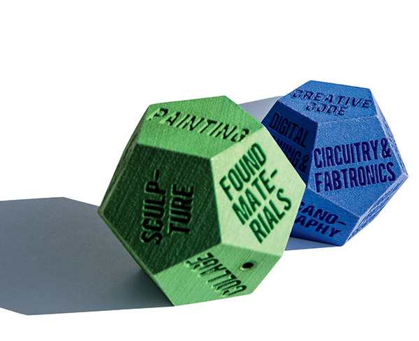 LUCK OF THE DRAWING Students in a class in TC’s Creative Technologies program, taught by Richard Jochum, roll these multi-sided dice to set parameters for new artworks they create.