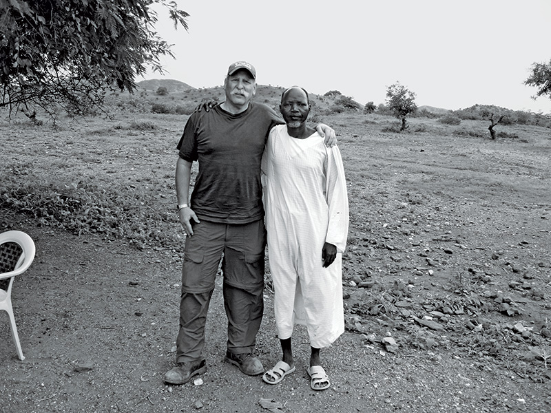 Sam Toten with a survivor of the Darfur genocide